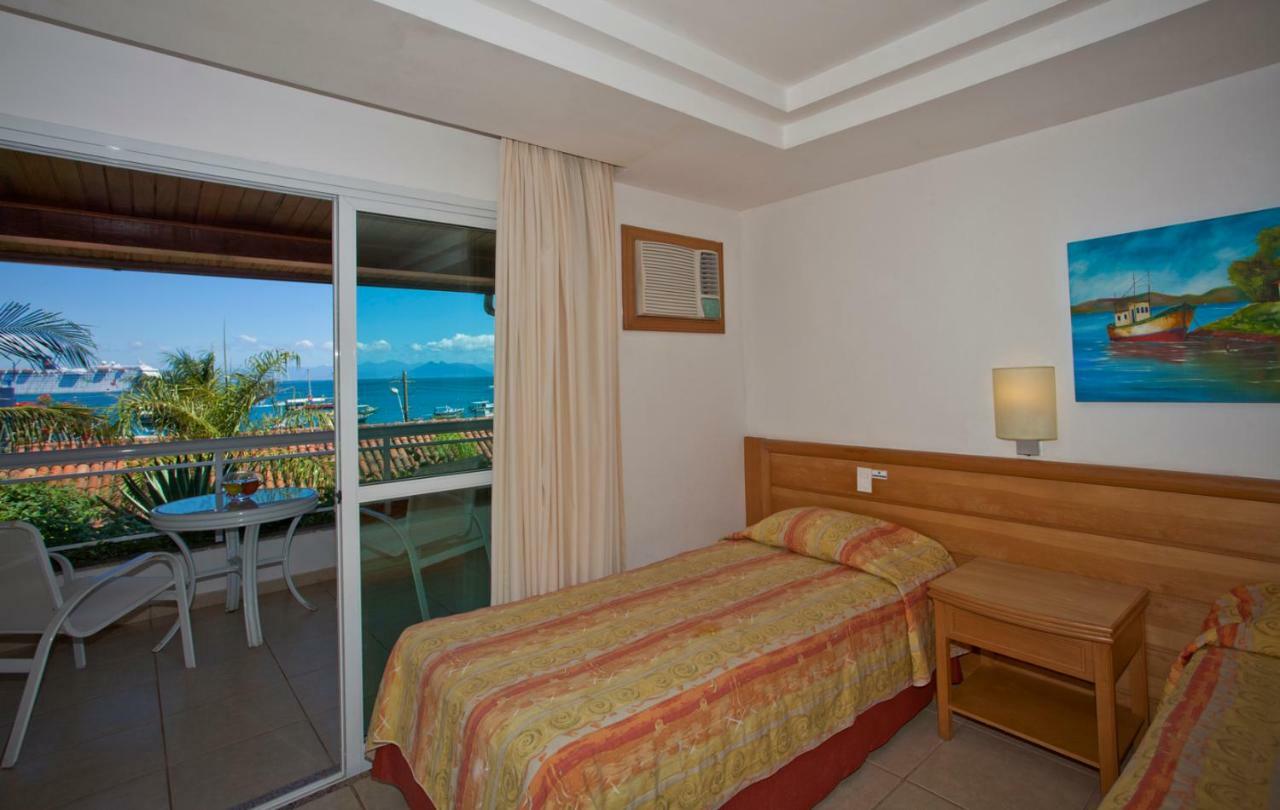 Hotel Atlântico Búzios Convention Extérieur photo A single bed